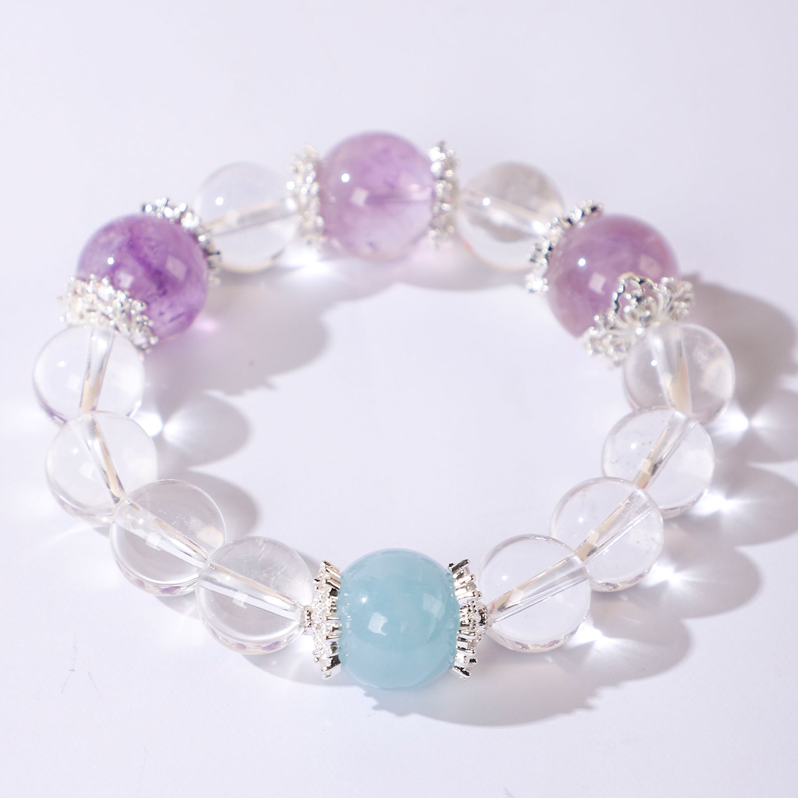 Bracelet with Three Purple Beads and One Blue Bead