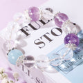 Bracelet with Three Purple Beads and One Blue Bead
